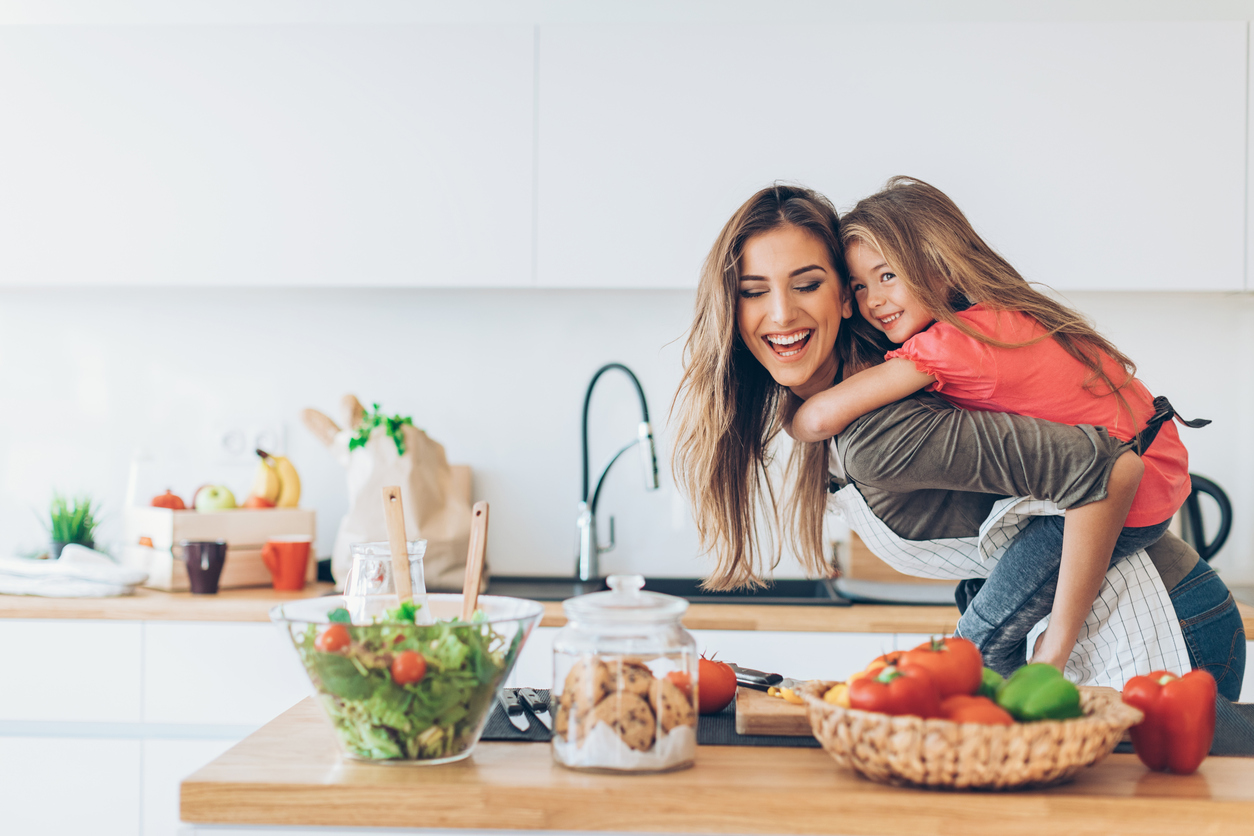 Happy Mother Having Fun Cooking with Daughter