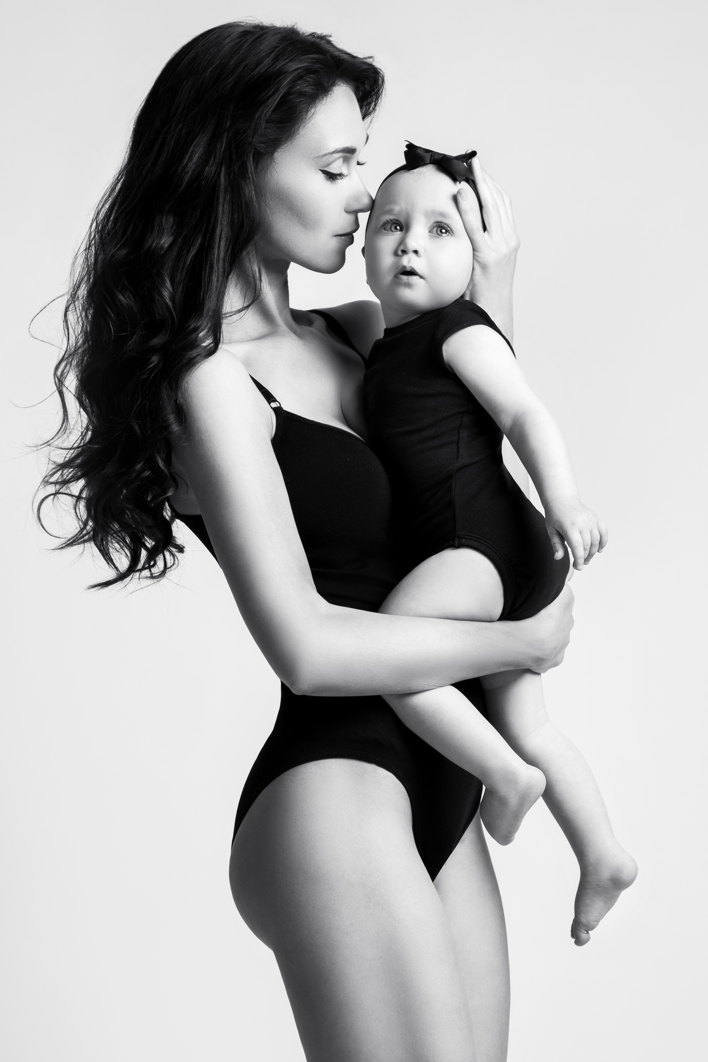 Beautiful Mother Holding Baby