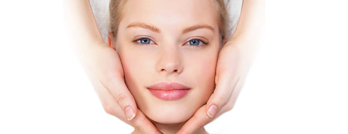 Happy Woman face receiving spa treatment